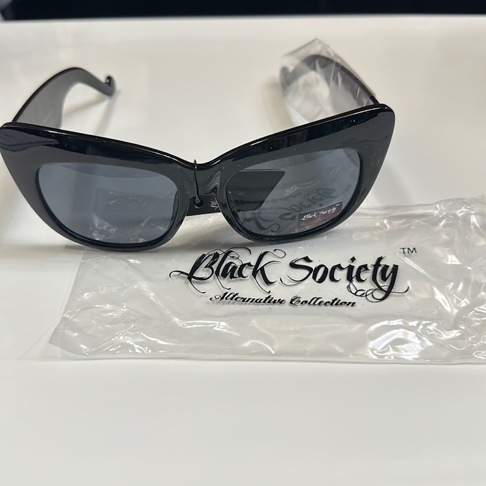 NWT Black Sunglasses with Skulls on Each Side